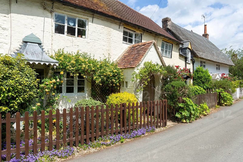 Attractive historic cottages in village of Avebury, Wiltshire, England, UK
