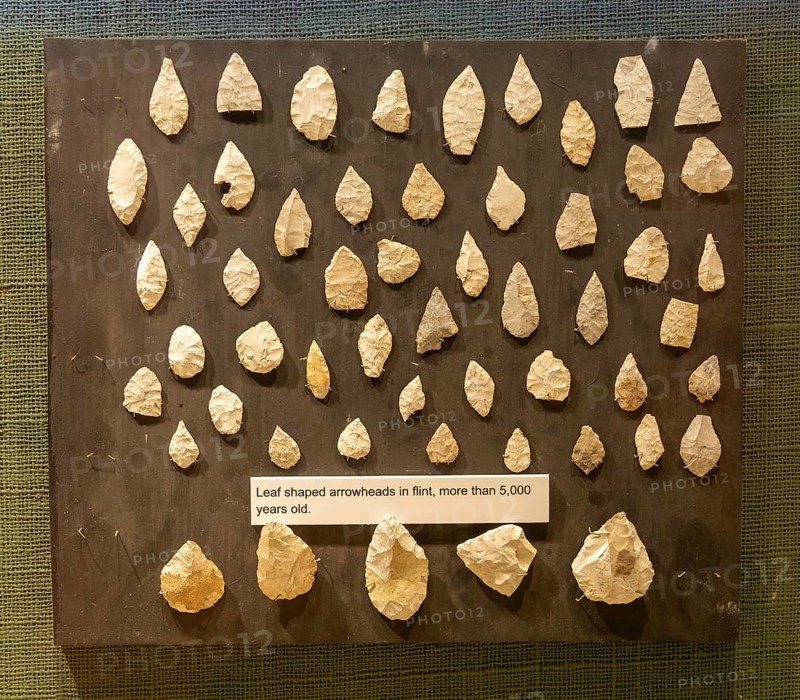 Neolithic archaeology exhibition inside Alexander Keiller Museum, Avebury, Wiltshire, England, UK - flint arrowheads