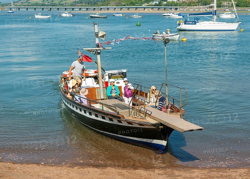 Shaldon ferry arriving, small boats in harbour at Back Beach, Teignmouth, south Devon, England, UK