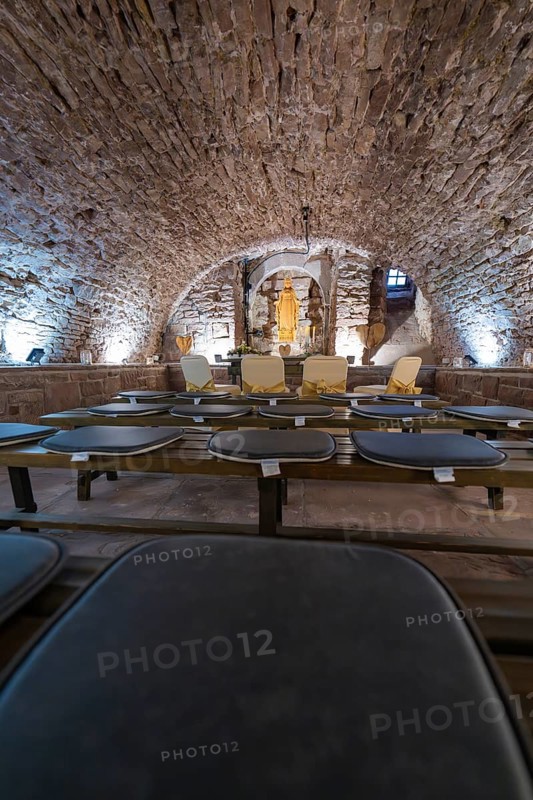 Vaulted cellar with sculpture, surrounded by stone walls and illuminated, sacred ambience, registry office, family celebration in Neubulach, district of Calw, Germany
