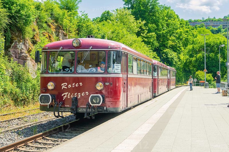 Close-up of a red train on a sunny platform, Calw railway station festival, Black Forest, Germany