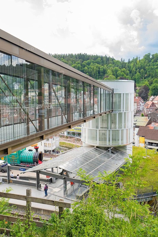 Modern bridge and tower in an urban landscape with hills in the background, Zob extension with bridge construction for the new Herman Hesse railway, Calw, Black Forest, Germany