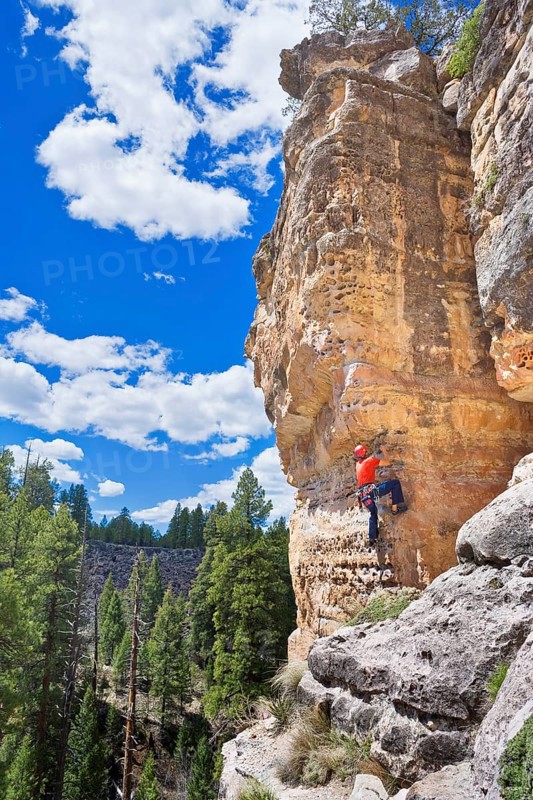 Man climbing canyon wall, Flagstaff, Arizona, USA
