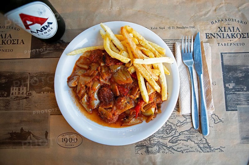 Spetsofai or Pelion sausage with onion and pepper sauce, typical dish from Pelion, Pelion peninsula or Pelion, Thessaly, Greece