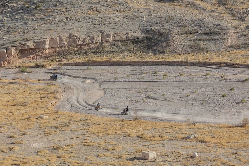 People riding all terrain vehicles through Echo Wash at Echo Bay, Nevada, USA