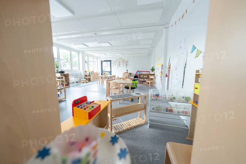 Light-flooded kindergarten room with toys and wall decorations, transitional containerised daycare centre, Gechingen daycare centre, Calw district, Germany