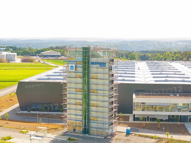 Front view of an industrial building with scaffolding and fields in the background, ING Park development area, Zweckverband INGpark Nagold Gäu, Nagold, Germany