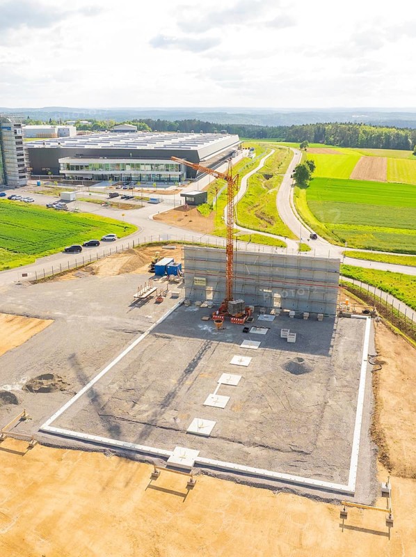 Large construction site with crane and unfinished structure in a rural setting, ING Park development area, Zweckverband INGpark Nagold Gäu, Nagold, Germany