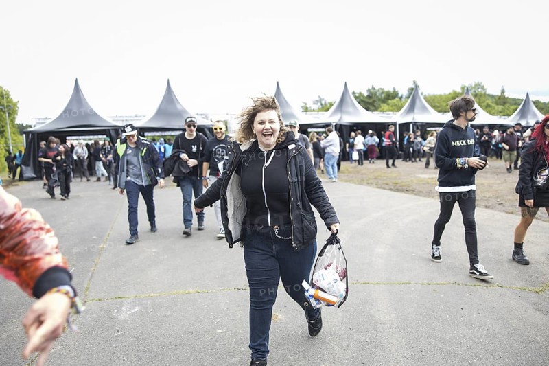 A festival visitor runs after passing the main entrance at the Rock am Ring Festival on Friday, Nürburgring race track race track, 06/06/2025