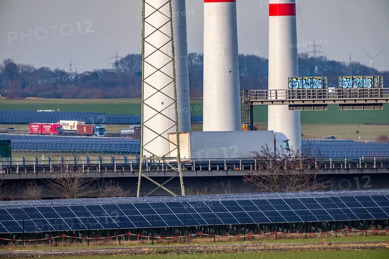 86.5 MW peak open space photovoltaic systems, from RWE, with over 141, 000 solar modules, on a side strip, over 1 km long, along the A44 motorway near Bedburg, at the Jackerath triangle, recultivated open-cast mining site, wind farm north of Titz, North Rhine-Westphalia, Germany