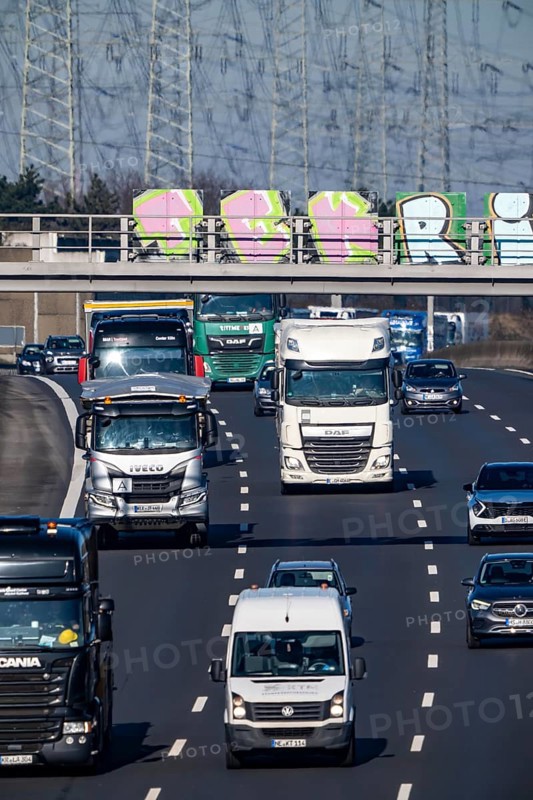 A57 motorway near Kaarst in the Rhein-Kreis Neuss, view towards Kaarst motorway junction, direction Cologne, heavy traffic, overhead line, high-voltage lines, along the motorway, North Rhine-Westphalia, Germany