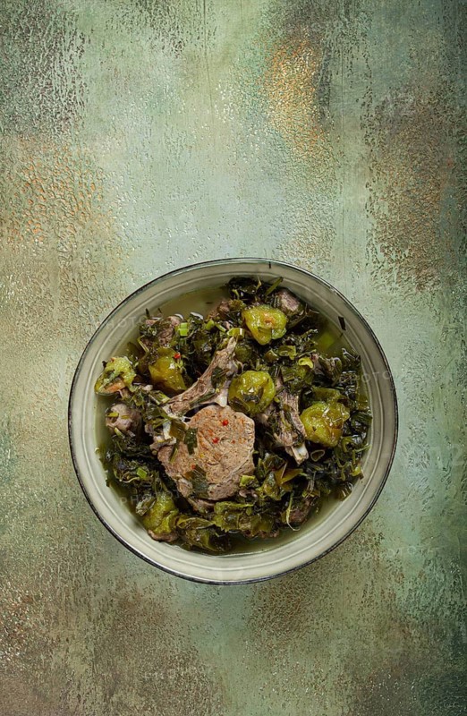 Chakapuli, Georgian dish, stewed meat with herbs and tkemali, in white wine, homemade, no people