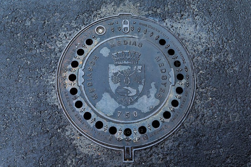 Manhole cover with city coat of arms of Medias, Romania