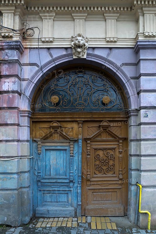 Wooden entrance portal with a 19th century residential building, Medias, Romania