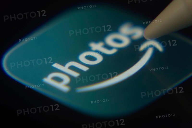 Dhaka, Bangladesh- 06 Dec 2025: Close-up of the Amazon Photos app on a screen with a stylus pointing at it