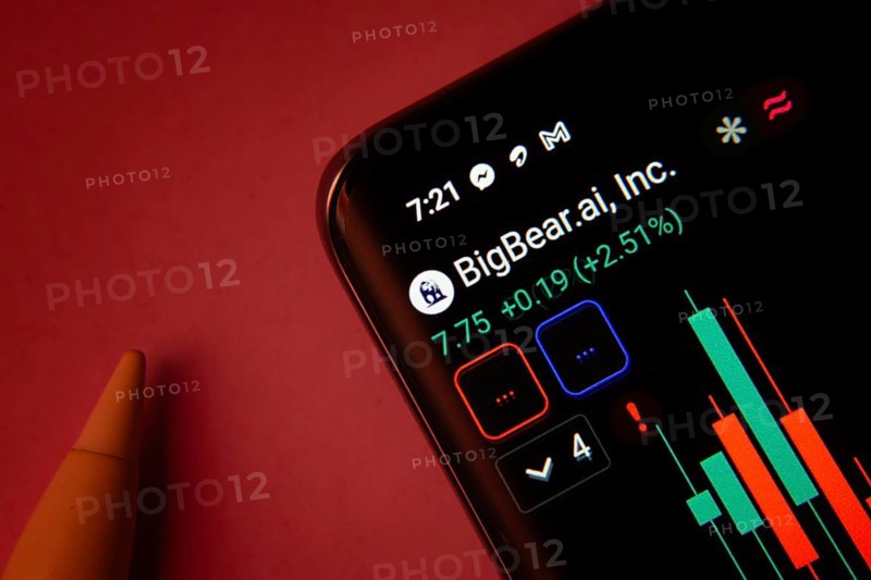 Dhaka, Bangladesh- 08 Sep 2025: Close-up of a phone screen showing BigBear Ai Inc stock market data with a candlestick chart