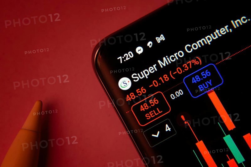 Dhaka, Bangladesh- 08 Sep 2025: Close-up of a phone screen showing Super Micro Computer Inc stock market data with a candlestick chart