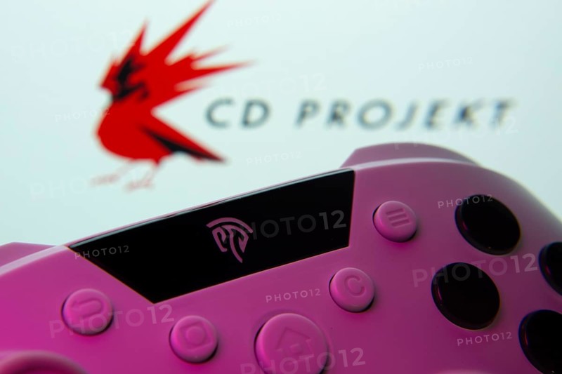 Dhaka, Bangladesh- 24 Mar 2025: A close-up of a gamepad with the CD Projekt seen on screen in the background