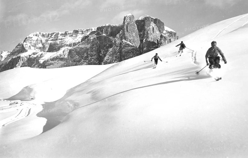 Winter skiing in front of the group Lagazuoi da Nuvolao, snow, group, mountaineer, downhill, skier, around 1930, high mountains, mountain, historic, Ampezzo Dolomites, South Tyrol, Veneto, Italy