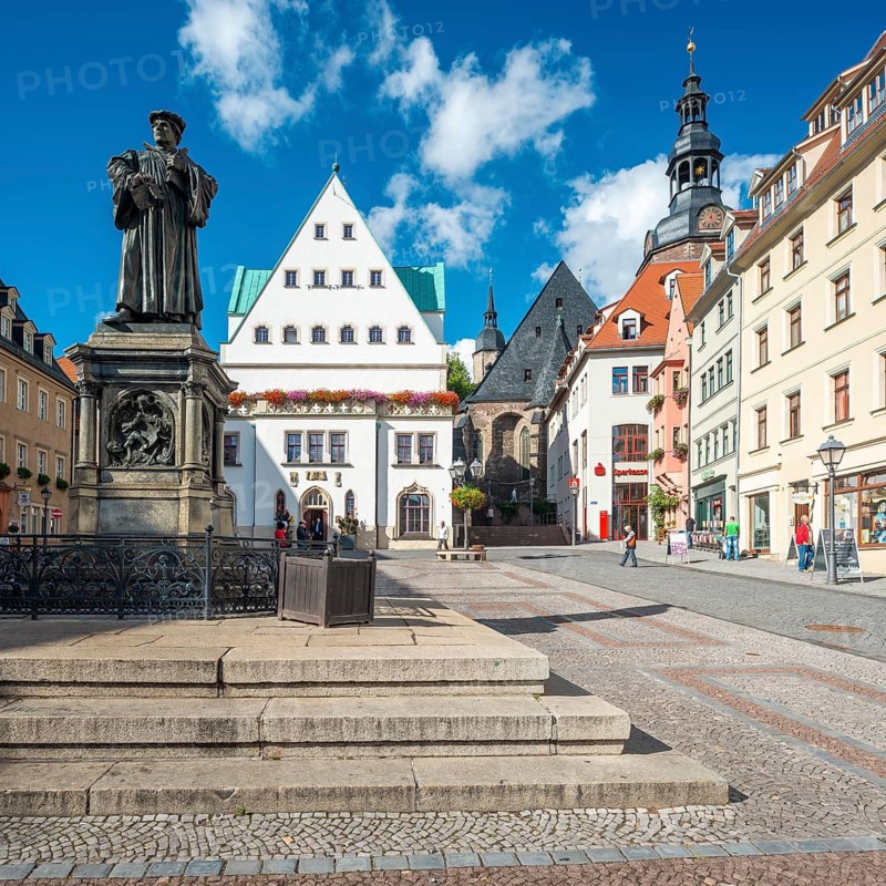 The market square of Eisleben with the monument to Martin Luther, Luther monument, bronze sculpture from 1883 by Rudolf Siemering, in the middle the historic town hall, St. Andrew's Church on the right, Luther city Eisleben, Saxony-Anhalt, Germany