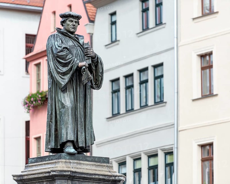 The monument to Martin Luther on the market square in Eisleben, Luther monument, bronze sculpture from 1883 by Rudolf Siemering, Luther city Eisleben, Saxony-Anhalt, Germany
