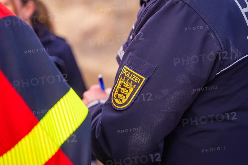 Close-up of a police uniform badge. Writing and coat of arms are visible, fire brigade exercise at the Hermann Hesse Railway, Ostelsheim, Calw district, Germany