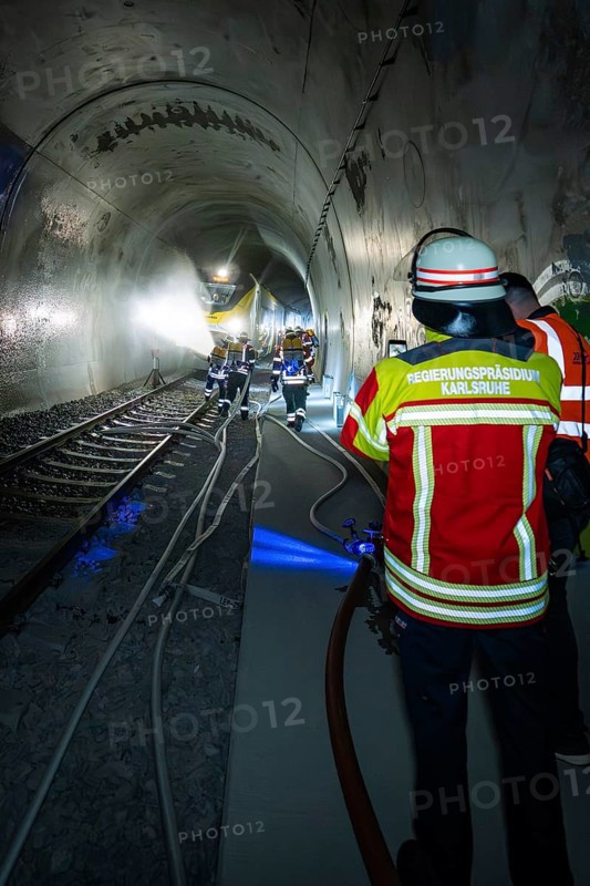 Deployment of firefighters in a tunnel with hoses and equipment, fire brigade exercise on the Hermann Hesse Railway, Ostelsheim, Germany