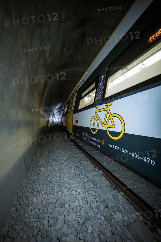 Train with bicycle graphics on the side passes through a tunnel, fire department exercise on the Hermann Hesse railway, Ostelsheim, Germany