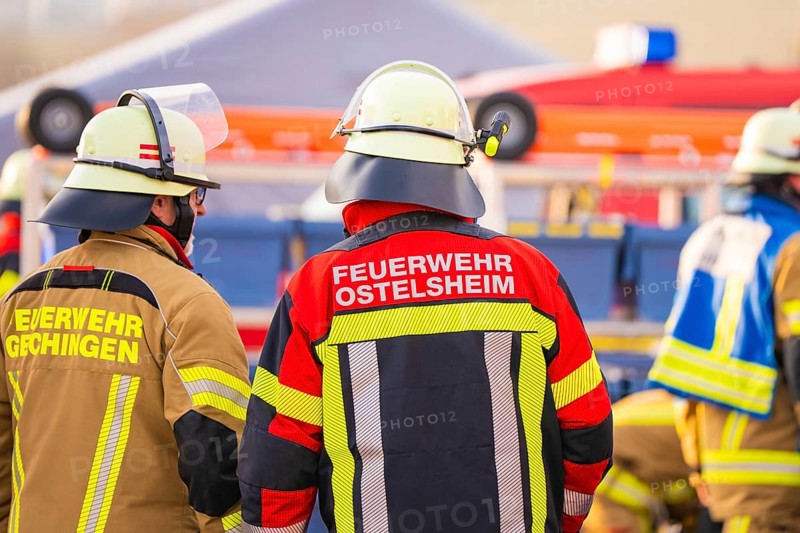 Several firefighters in protective clothing on duty, fire brigade exercise on the Hermann Hesse railway, Ostelsheim, Germany