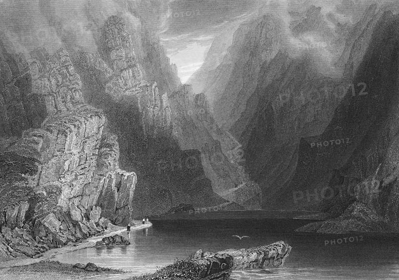 Breakthrough at Dunloe on Lough Leane, County Kerry, Ireland, lakeside hiker, hiking trail, bird, mountain road, quiet atmosphere, wild mountain landscape, steep rock walls, landmark, steel engraving, 19th century, historical illustration from 1845