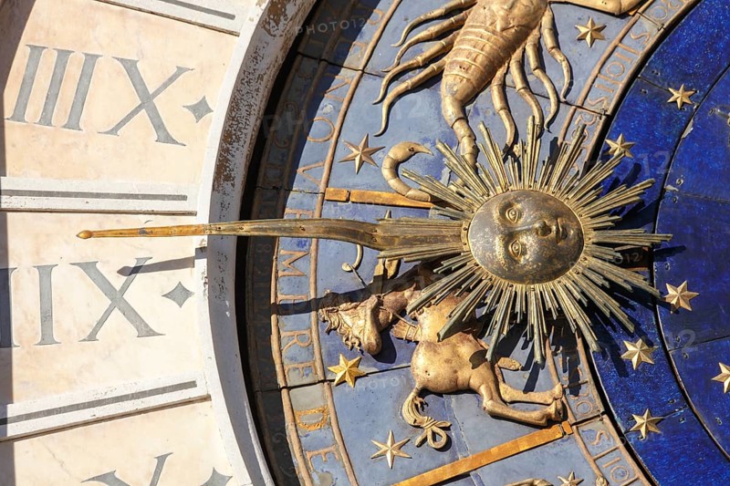 The astrological clock with moon phases and zodiac signs and lapis lazuli dial, in St. Mark's Square, Venice, Veneto, Italy