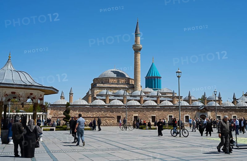 View of a mosque with several domes and minarets under a blue sky, Mevlana Museum, Mevlana, landmark, mausoleum of Mevlânâ Jalal ad-Din Rumi, Konya, Central Anatolia, Turkey