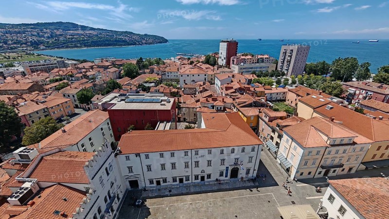 View of a coastal town with red roofs and the sea in the background, Izola, Slovenia