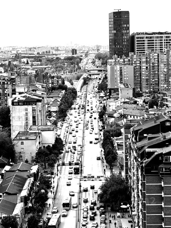 City view of a busy street with skyscrapers in the background in black and white, Pristina, Kosovo