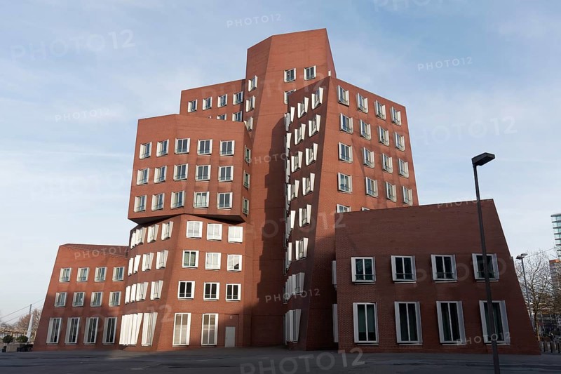 New Zollhof by architect Frank O. Gehry, red house with brick façade, Gehry buildings in the Deconstructivist style, Düsseldorf, North Rhine-Westphalia, Germany