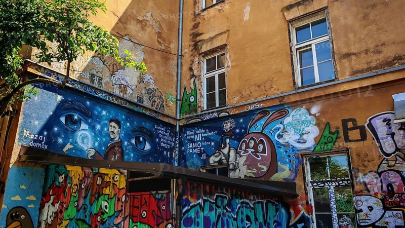 Colourful graffiti on an old building wall with windows and urban atmosphere, Ljubljana, Slovenia