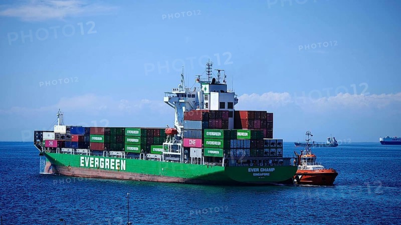 A large container ship on the high seas under a bright blue sky, Koper, Slovenia