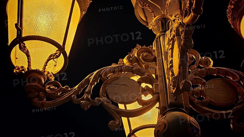 Close-up of an artfully designed lantern with golden lighting at night, Skopje, North Macedonia