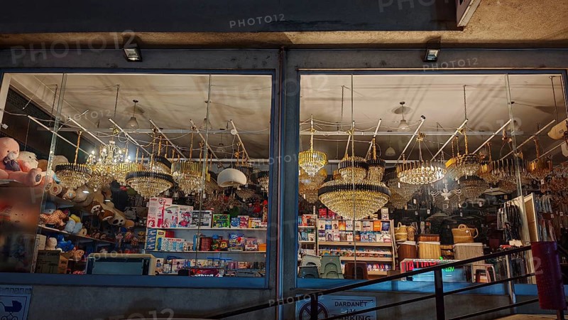 An illuminated shop with various lights and lamps in a shop window, Kosovo