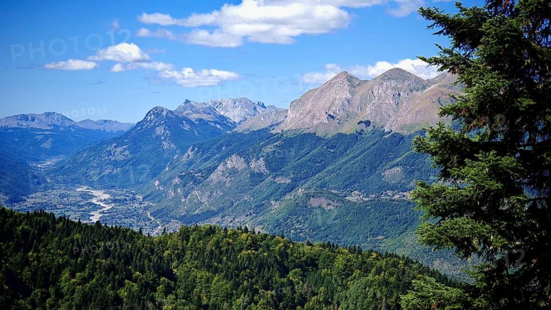 Impressive mountain landscape surrounded by green forests and clear skies, Peaks of the Balkans, Montenegro