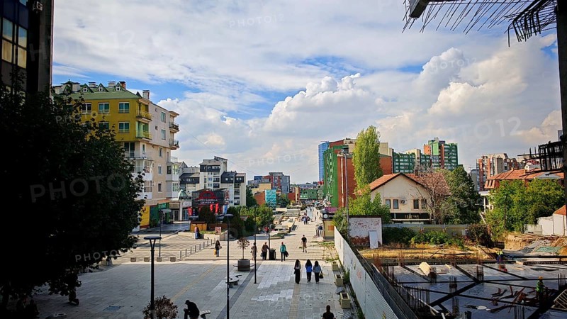 City view with modern buildings, under a cloudy sky, Pristina, Kosovo