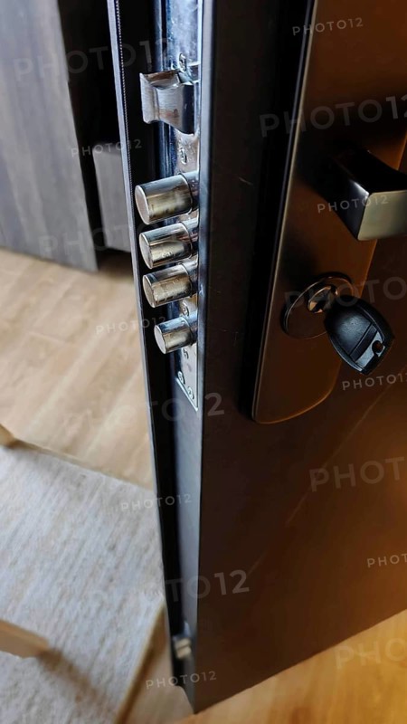 Close-up of an opened door lock with visible metal bolts, security in hotel, Kosovo