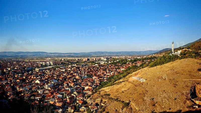 Wide view of a city and surrounding hills under blue sky, Prizren, Kosovo