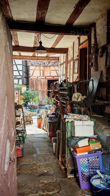 View of a rustic courtyard full of old tools and objects, Upper Franconia