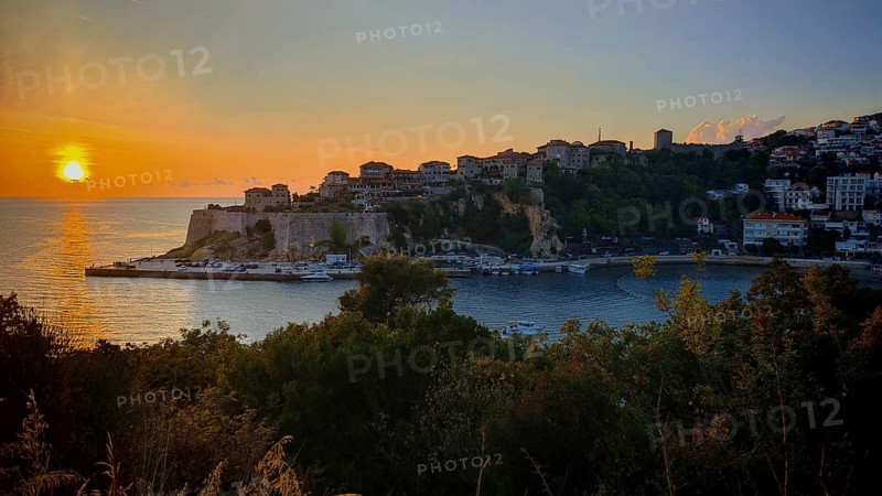 Sunset over the coast with historic buildings and sea view, Ulcinj, Montenegro