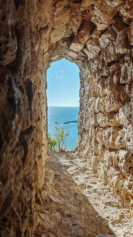 Rocky passageway overlooking the blue sea, peaceful and quiet atmosphere, Montenegro