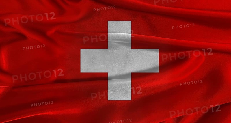 Flag of Switzerland with fabric textured background. Close up of National flag of Switzerland with realistic texture