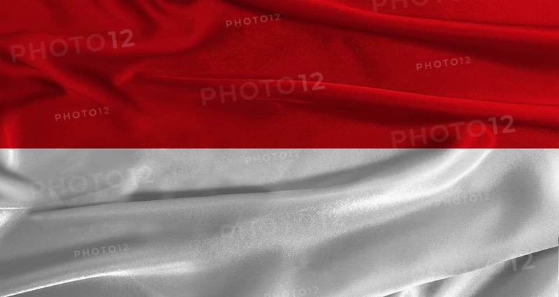 Flag of Monaco with fabric textured background. Close up of National flag of Monaco with realistic texture