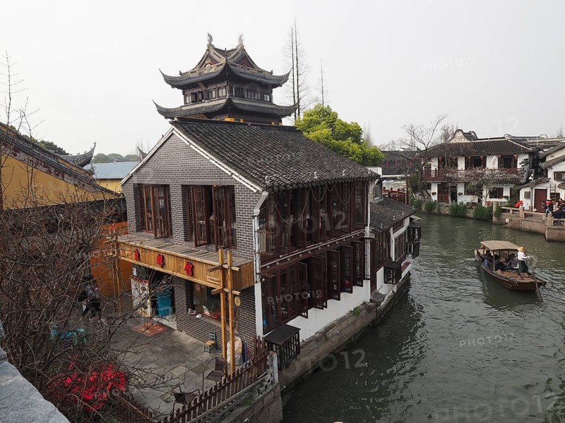 A Chinese-style building on the banks of a canal on a traditional boat, Zhujiajiao Ancient Town, Shanghai, China