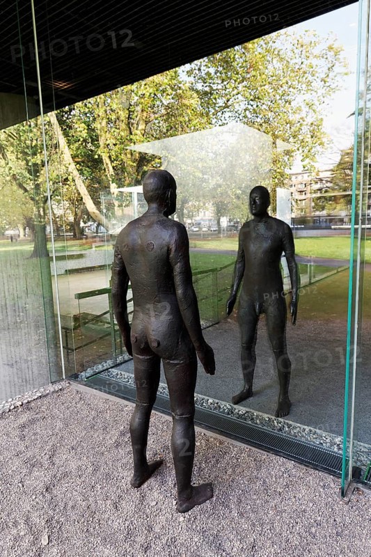 Male figure looking at her real reflection, Reflections II sculpture by sculptor Antony Gormley, Lehmbruck Museum, Duisburg, North Rhine-Westphalia, Germany
